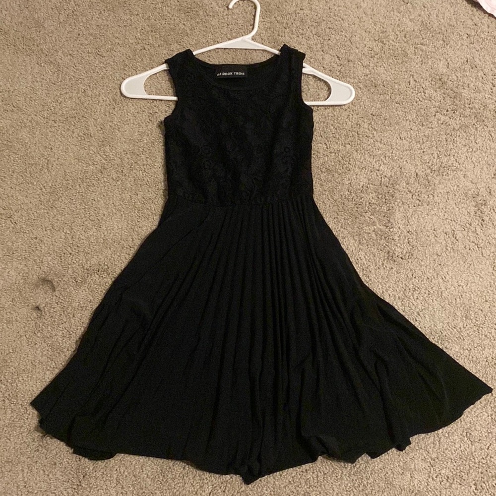 It is a black dress that is a fancy dinner dress.